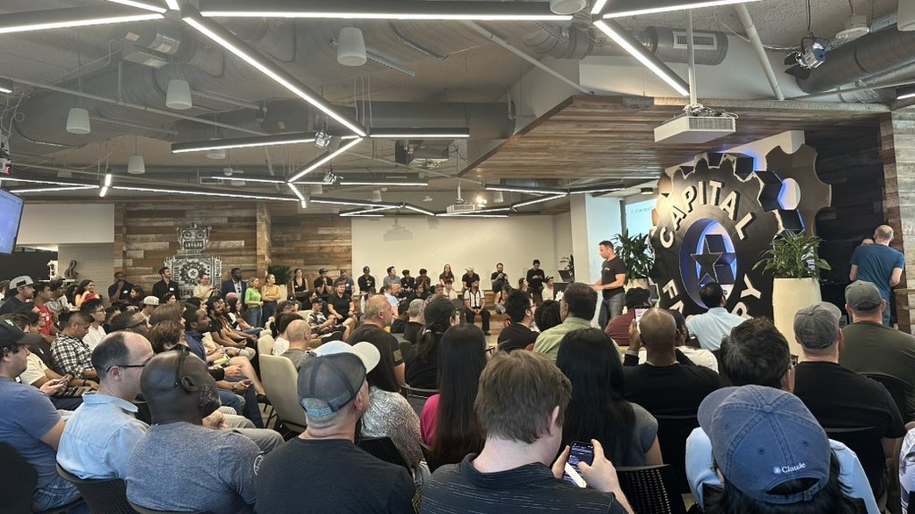 A packed Capital Factory crowd at a Clustr AI session