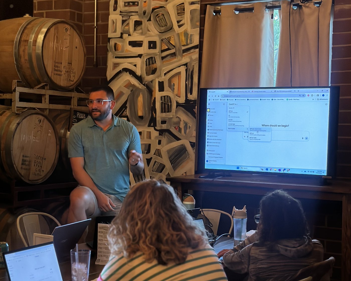A Clustr trainer leading a live ChatGPT workshop with the product on screen