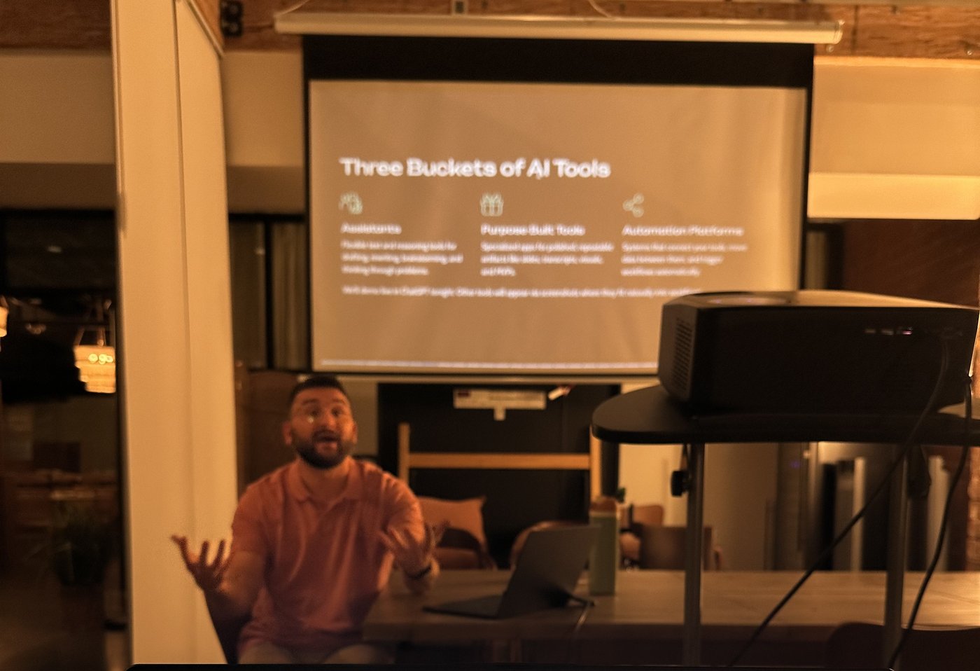 Clustr trainer teaching the three buckets of AI tools at a community workshop